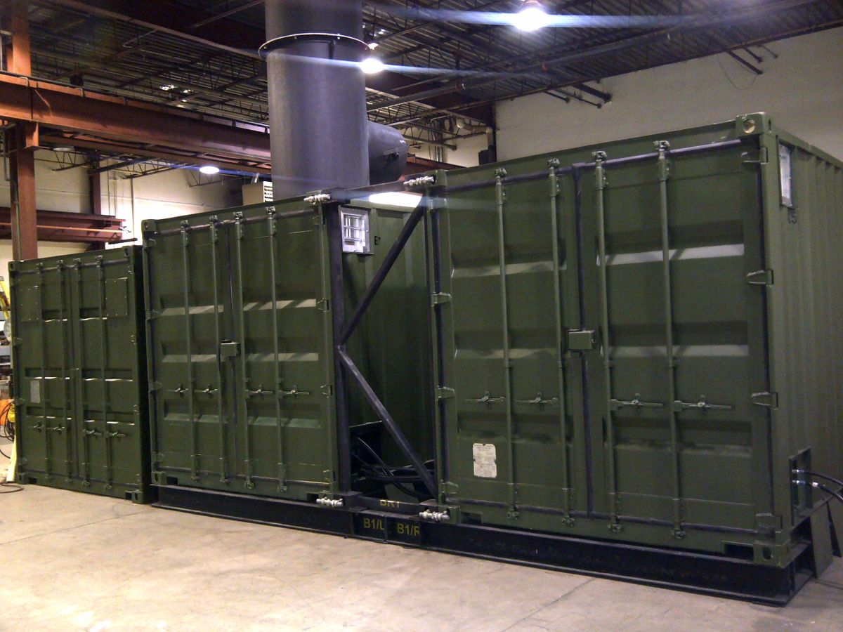 20 FT Shipping containers converted for use as an incinerator and spacer to allow for ductwork between the containers